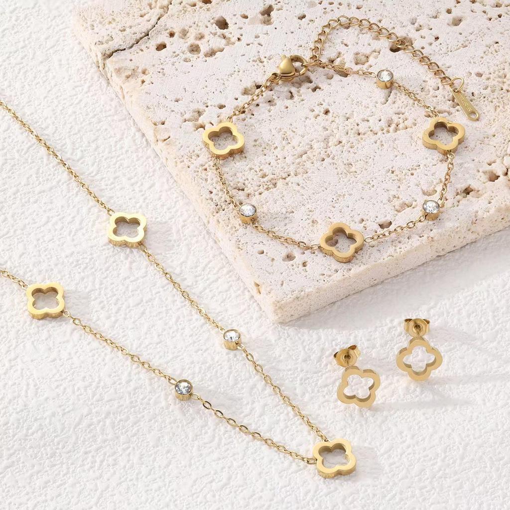18K Gold Four-Leaf Clover Jewelry Set: Necklace, Bracelet, and Earrings in Titanium Steel with Zirconia.