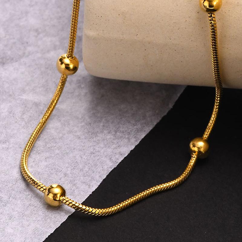 Gold-Tone Titanium Steel Snake Chain Bracelet with Beads - Non-fading, Simple Design for Women.