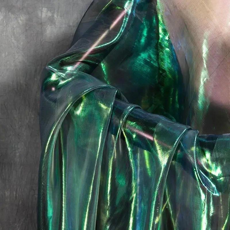 Buntes glitzerndes Netzgewebe Illusionäre Farbfotografie Hintergrund Transparentes Gaze-Kleid Performance-Kleidung Stoff