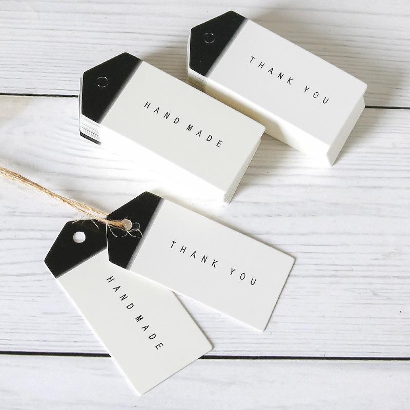 50 Černobílých šipkovitých ručně vyráběných visaček 'Děkuji' na balení pečiva