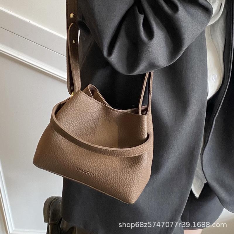 Fashion design hand-held small bag bag women's 2025 new retro versatile bucket bag women's commuter shoulder crossbody bag