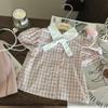 2025 Girls' Korean Academy Style Plaid Shirt & Pink Pleated Skort Set