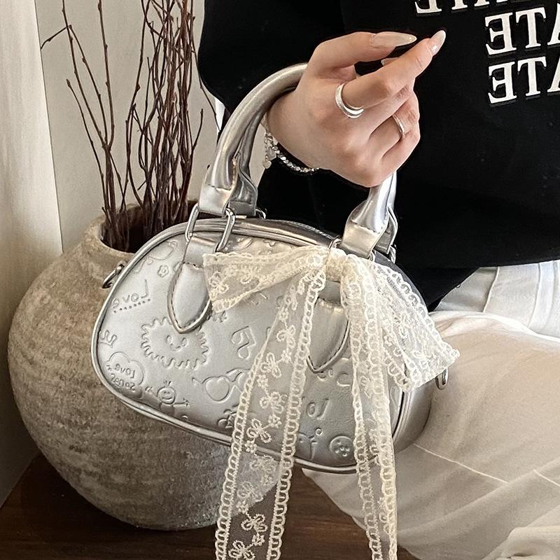 Korean high-end sense sweet wind simple cute embossed portable Boston bag casual versatile foreign style messenger bag women