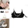 Stylish Medium Size Seashell Shape Saddle Bag With Chain Strap In Black Color