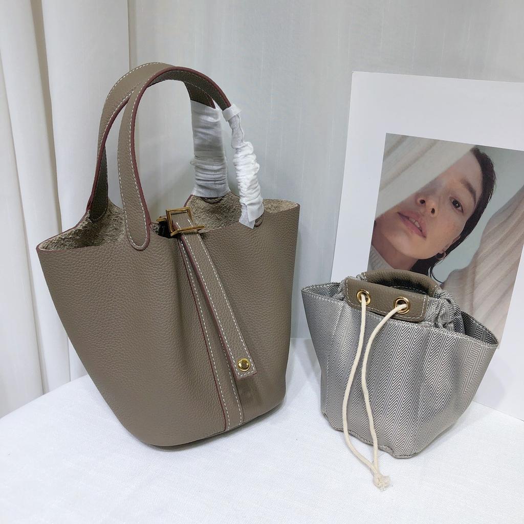 Spot wholesale top layer cowhide vegetable basket bag leather bucket bag commuter fashion lock buckle hand-held handbag woman