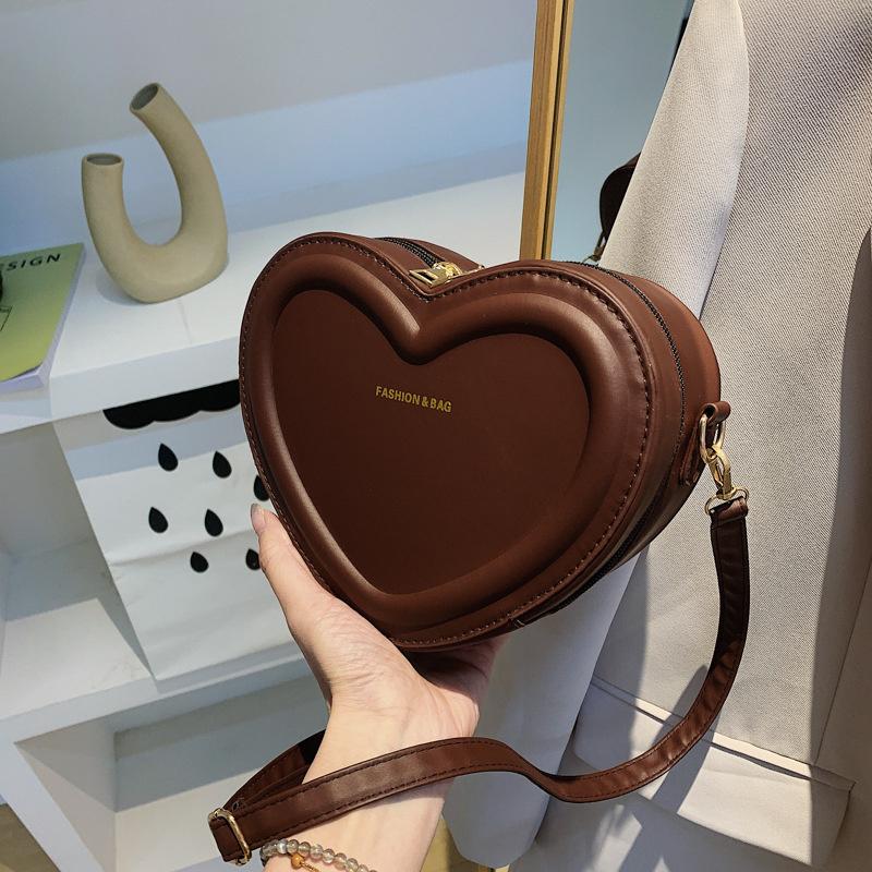 Einfarbige PU-Leder-Schultertaschen Herzform Crossbody-Taschen für Damen Modische Kleine Handtaschen und Geldbörsen