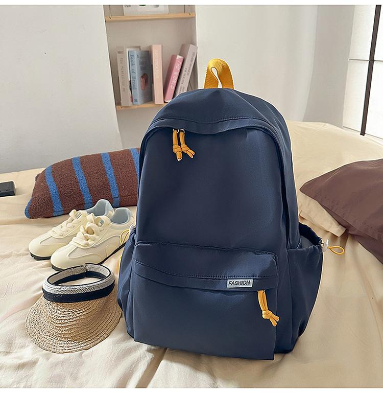 Schoolbag Korean version ins Solid color simple schoolbag Lazy wind backpack Female junior and high school students lightweight large-capacity 