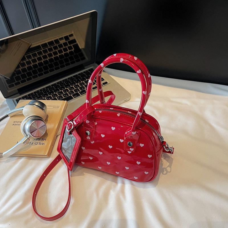 

2025 new commuter hand-held shell bag versatile fashion polka dot messenger bag niche design portable bowling bag 21*10*12