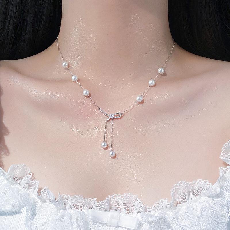 Süße Schleife, Perlenquaste Halskette, Weibliches Nischendesign, Elegante Perlen Schlüsselbeinkette