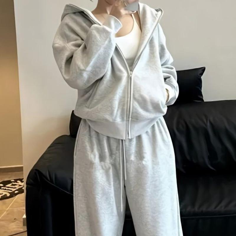 Jednoduchá jednobarevná ležérní sportovní souprava pro ženy na podzim a zimu, obsahující bundu s kapucí a široké kalhoty