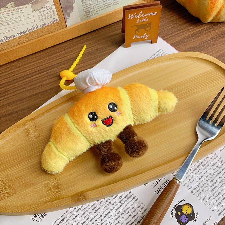 Kreativní plyšový přívěsek s jídlem: Panenka dort, bageta, croissant - Zábavný dárek k promoci