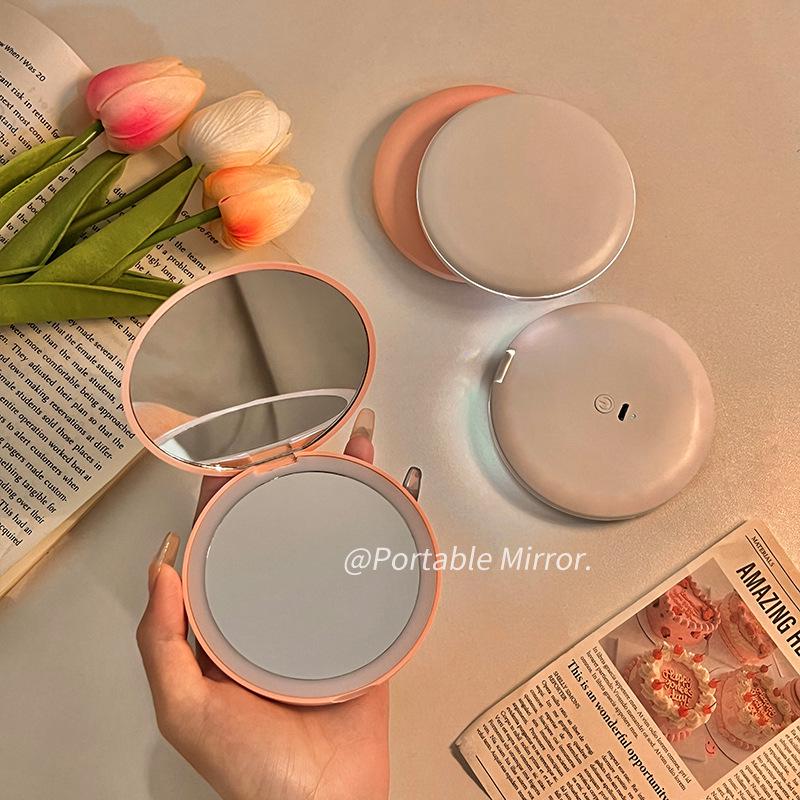Portable LED Light Makeup Mirror - Compact, Handheld, Foldable, Round Mirror with Touch Light for Carry.