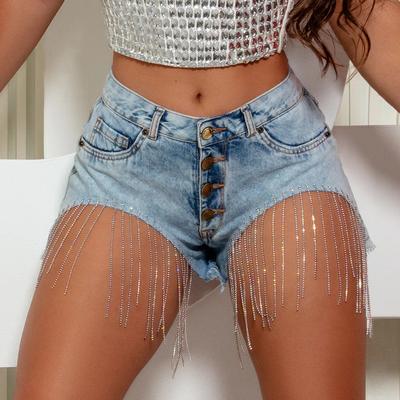 Nouvelle collection printemps/été 2024: Short de cow-boy sexy et épicé européen et américain, chaîne pour femme, pompon, pantalon chaud ultra court