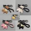 Handwoven Cartoon Leather Car Keychain Pendant