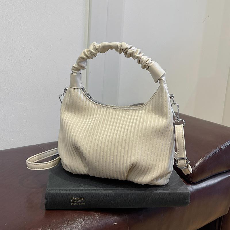 

Нишевая личность плиссированная полосатая портативная маленькая сумка женская мода универсальная сумка под мышкой 2025 осень и зима простая сумка через плечо белый