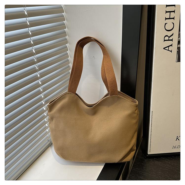 

Нишевая простая однотонная сумка-тоут женская 2025 новая персонализированная модная простая сумка через плечо литературная и повседневная холщовая сумка хаки