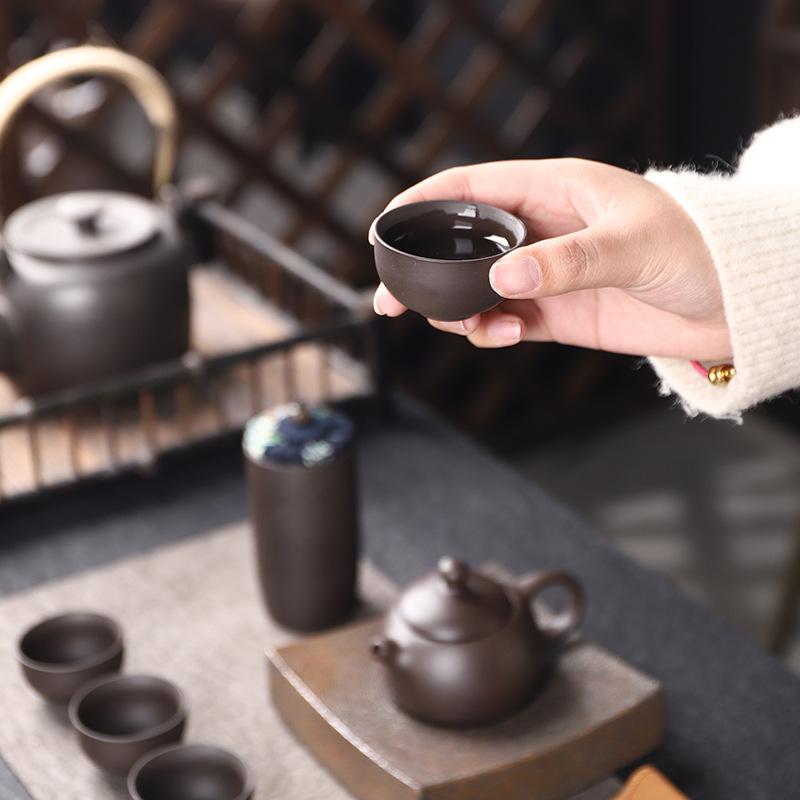Purple sand travel kung fu tea set, one pot, four cups, portable bag, express cup, small gifts for outdoor business activities
