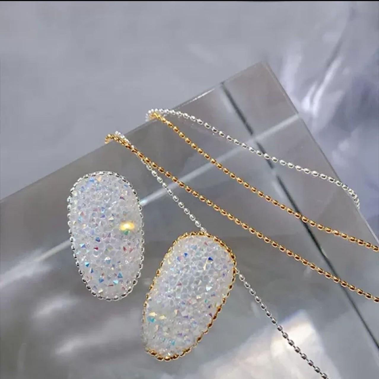 

Нейл-арт Цепь Чистое Желание: Золотые и серебряные бусины из стальных шариков для украшения ногтей 1mm New Gold Pearl Chain - 1 Meter