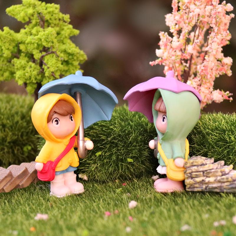 Cartoon Girl Raincoat Figurine: Cute Umbrella-Holding Doll for Desktop or Car Decor