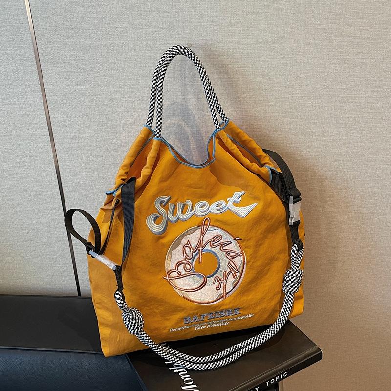

Новая сумка-шоппер с вышивкой в виде пончика, большой вместимости, из нейлона, экологичная, портативная, на плечо, универсальная сумка-мессенджер жёлтый