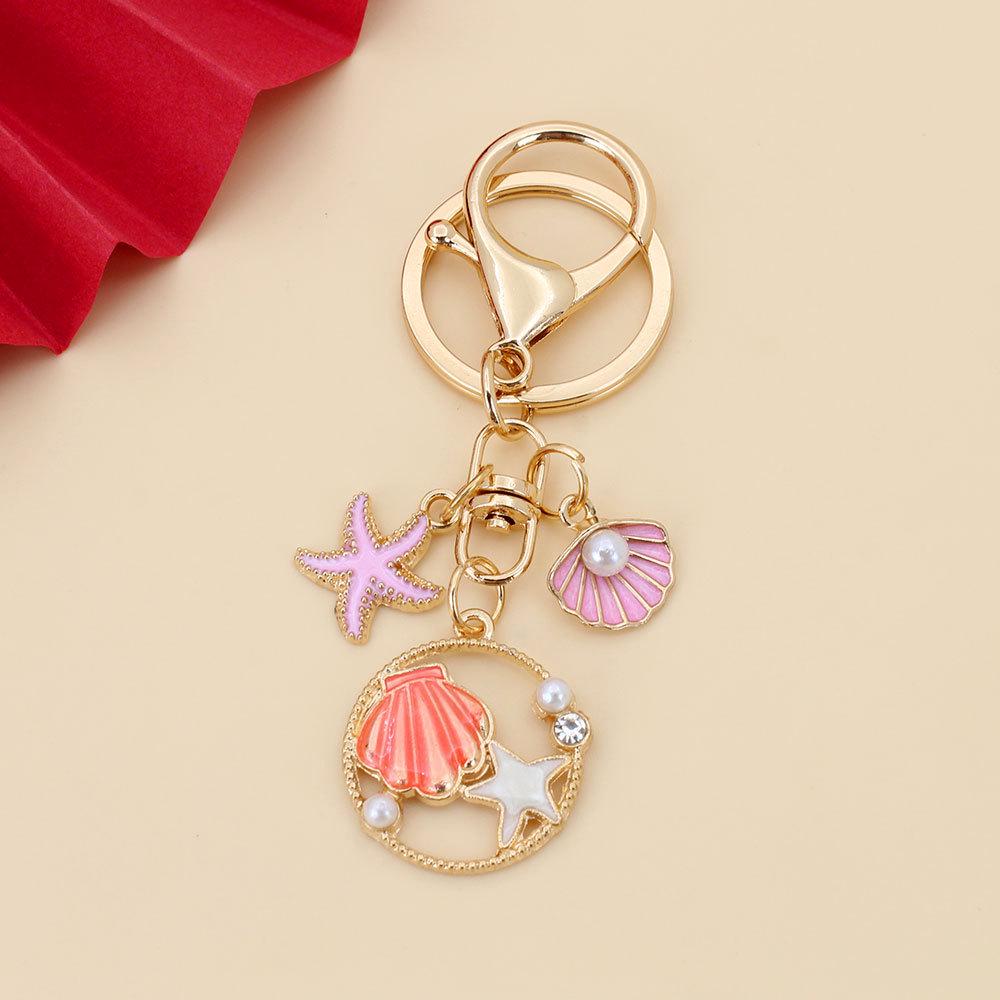 

Pearl Starfish Keychain: Women s Ocean Souvenir Bag Charm