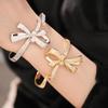 Ningguang Gold-Plated Zirconia Bow Cuff Bracelet: Luxury European-American Fashion Accessory
