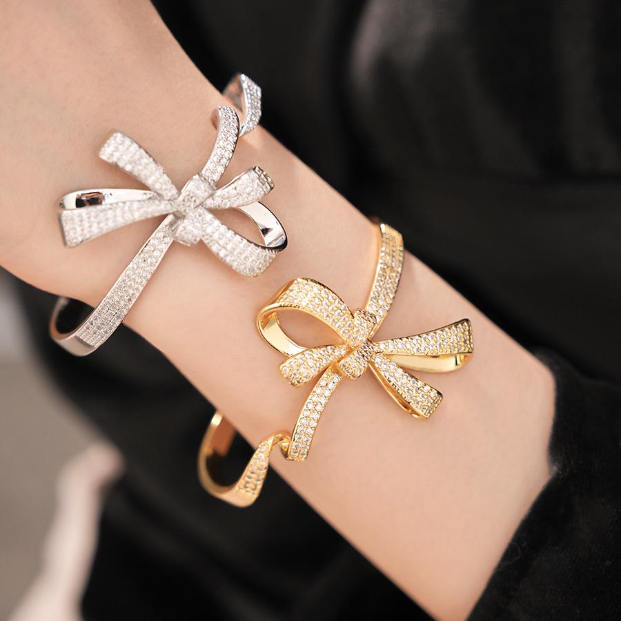 Ningguang Gold-Plated Zirconia Bow Cuff Bracelet: Luxury European-American Fashion Accessory
