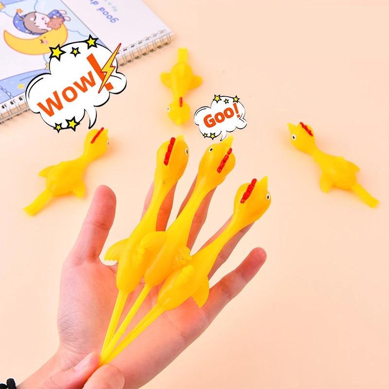 5-50pcs Novelty Catapulted Ejection Chicken Toy Light Rubber Finger Prank Flying Toy Slings Chicken Finger Toys Turkey Sticky