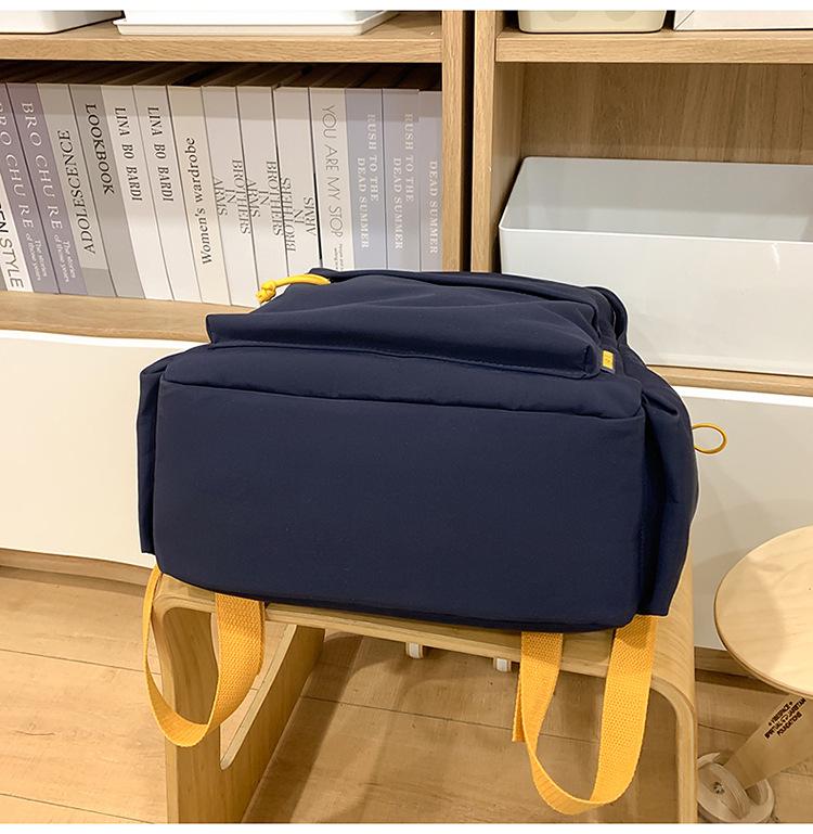 American High Street Large-Capacity Weight-Reducing Backpack for Middle School Boys and Girls