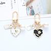 Creative Rose Heart Metal Keychain Pendant with Pearl Accent - Stylish Ornament for Earphone Case or Bag