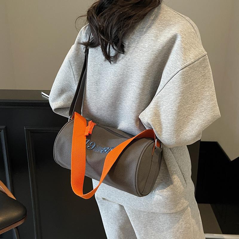 Simple bag 2025 new cylinder bag women's bag messenger bag canvas bag Oxford cloth casual small shoulder bag trend