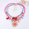 Light luxury ocean vacation style color dopamine multi-layer stacking alloy sun face pendant necklace female
