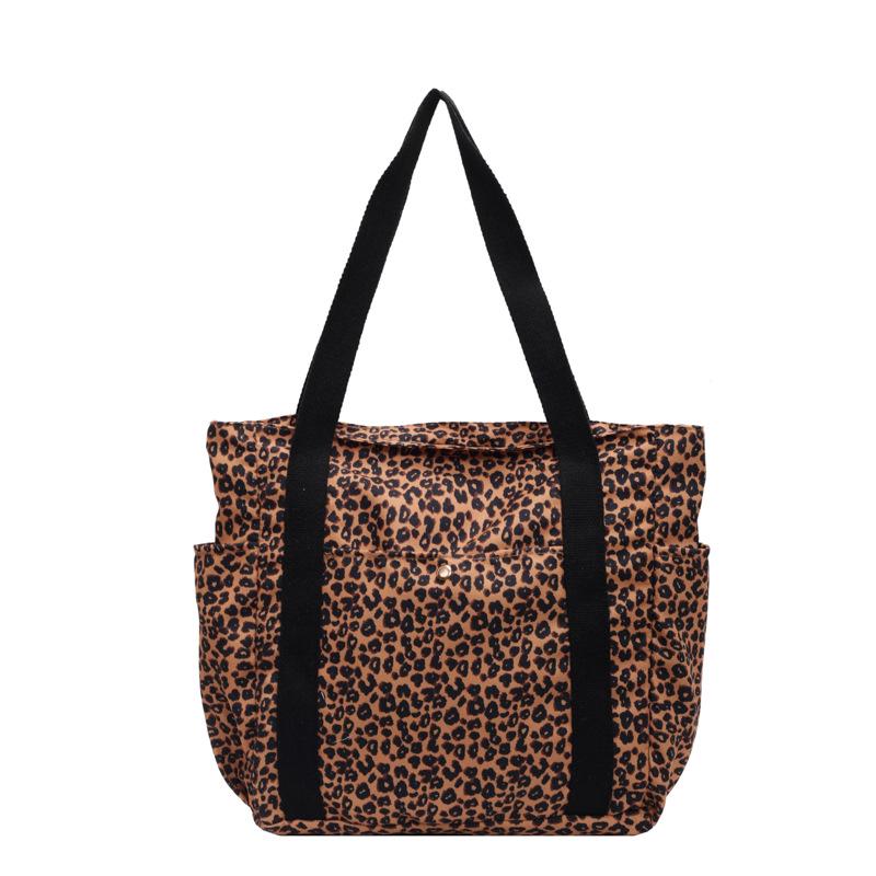 Leopard Print Canvas Tote: Large Capacity Autumn Shoulder Bag for Women, Versatile for College and Commute.