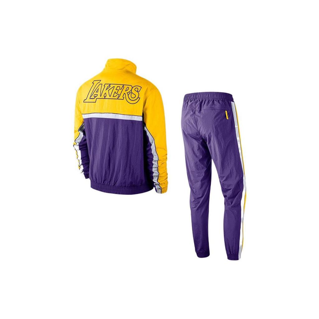 Nike Męski Zestaw Sportowy Kurtka Zapinana na Zamek ze Stójką z Nadrukiem Logo Los Angeles Lakers i Spodnie Joggers ze Sznurkiem Żółto-Fioletowy AV0619-504