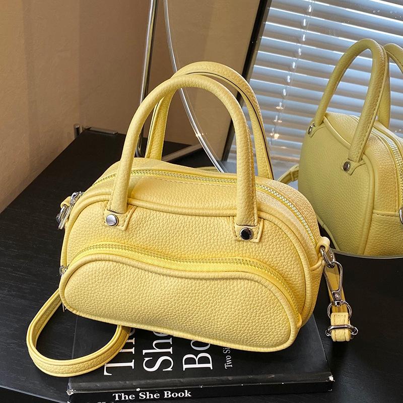 Korean version of trendy simple lychee pattern cream portable pillow bag women's leisure commuting versatile high-end messenger bag