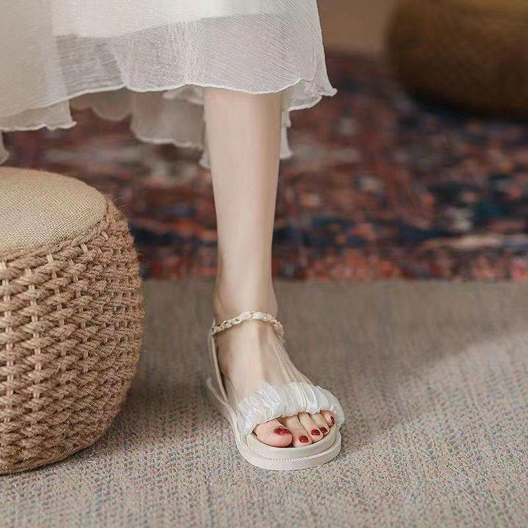 

Sandals women s summer 2025 new flat bottom word with versatile fairy wind platform muffin Internet celebrity Roman shoes 40