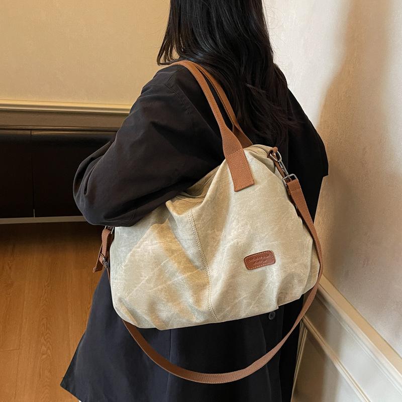 Fashion large-capacity travel bag contrasting colors 2025 casual retro canvas versatile messenger bag shoulder bag handbag