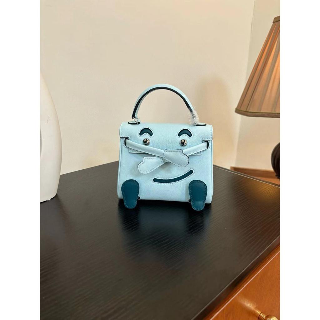 Borsa a faccina sorridente nuova per la primavera e l'estate 2025 borsa Kelli mini in pelle bovina di primo strato di alta gamma borsa a tracolla carina da millenial