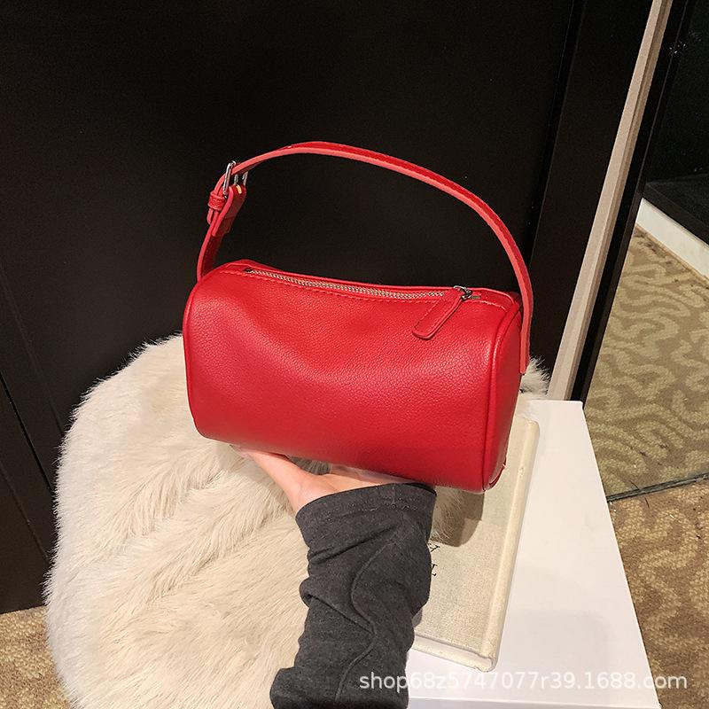 Korean version wide shoulder strap cylinder bag women's 2025 spring new niche pillow bag fashionable versatile single shoulder messenger bag