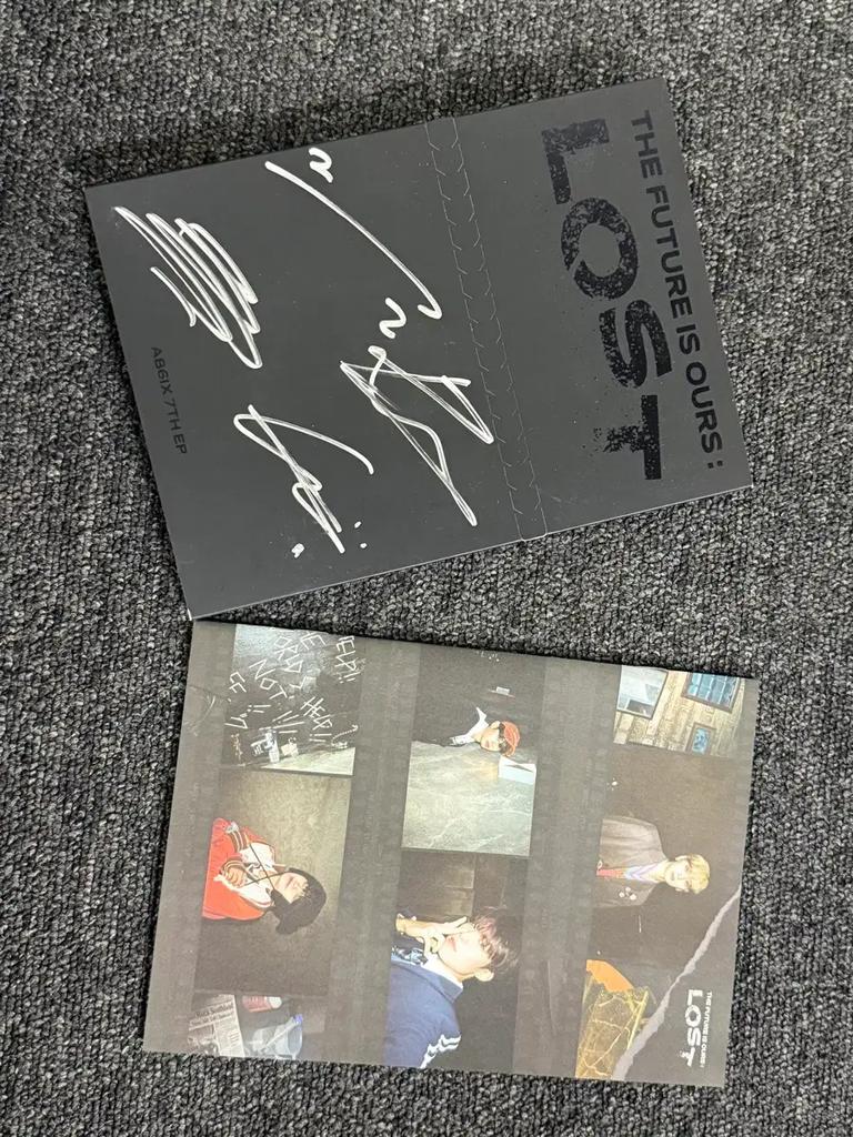 This is a sale of AB6IX's 7th EP, LOST, with handwritten signatures.