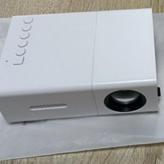Best-Selling YG300 Yellow-White Mini Portable Projector with Mobile Screen Mirroring for Home Entertainment.