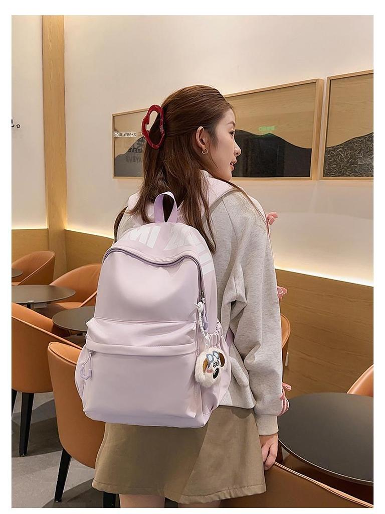 Versatile Letter Print Backpack for Students - Large Capacity for Junior High, High School, University, and Commuting.