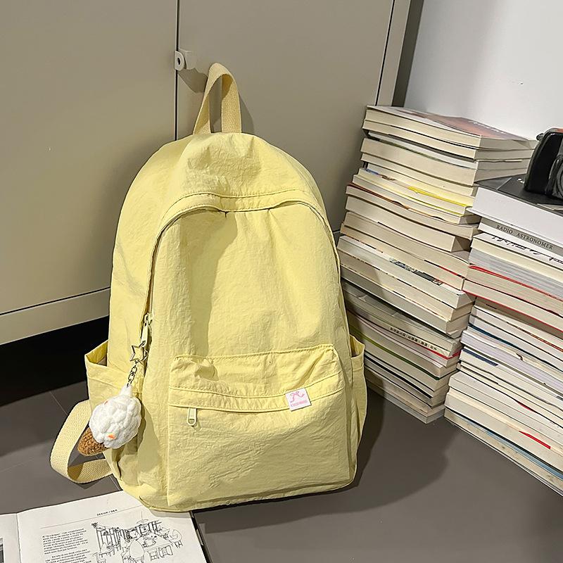 Japanese simple solid color schoolbag female college student casual versatile backpack large capacity junior high school student travel backpack