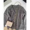 Autumn and winter new round neck gray knitted cardigan sweater women's raccoon fleece jacket top soft waxy skin-friendly