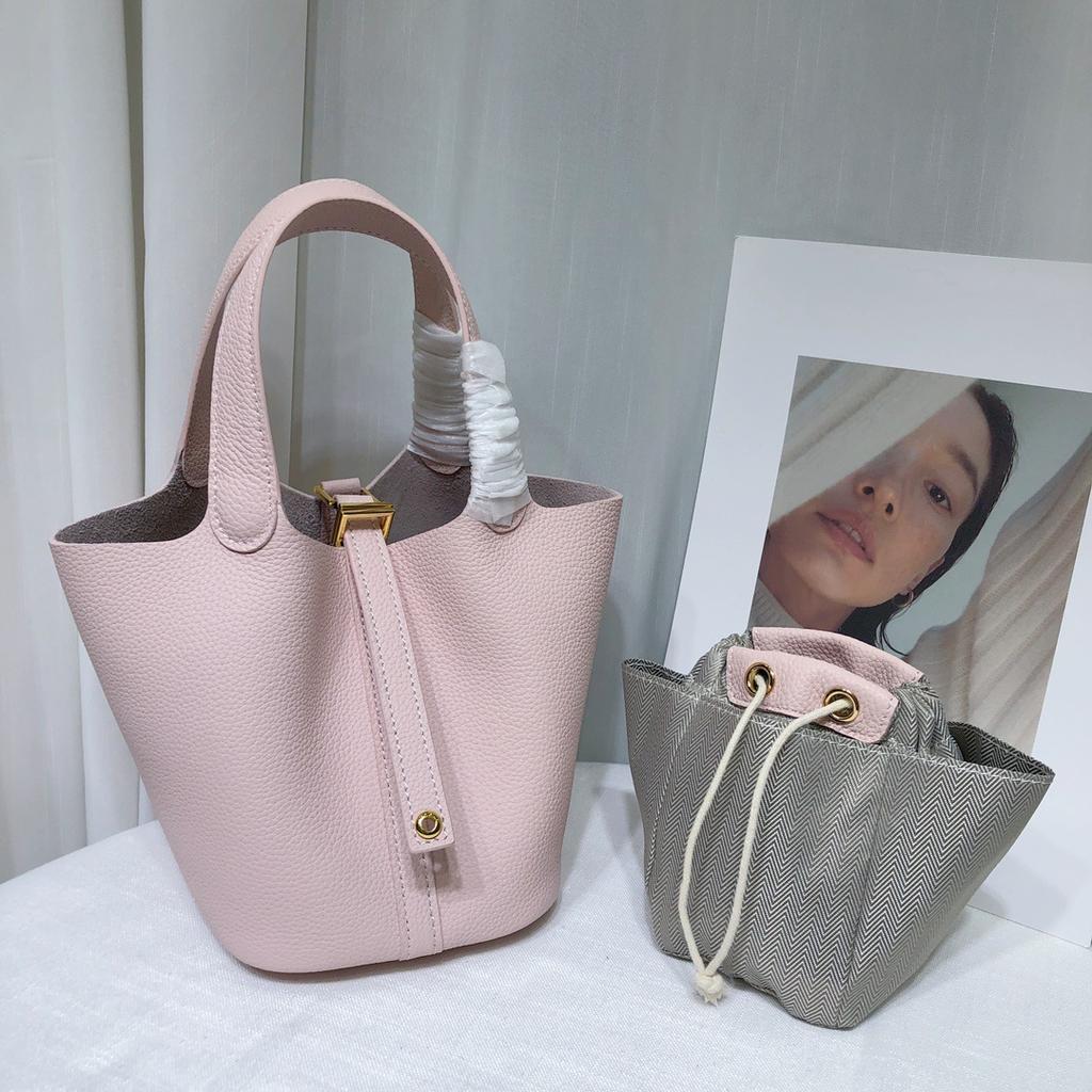 Spot wholesale top layer cowhide vegetable basket bag leather bucket bag commuter fashion lock buckle hand-held handbag woman