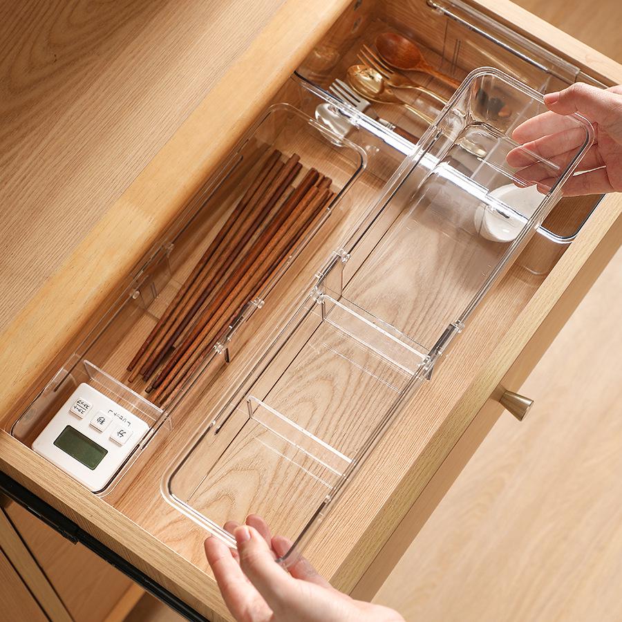 Expandable Transparent Storage Box with Dividers for Utensils, Cosmetics, and Sundries.