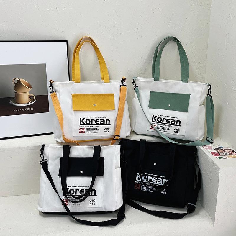 Simple style women's hand-held canvas bag New trendy versatile messenger shoulder bag Large capacity student commuter armpit bag