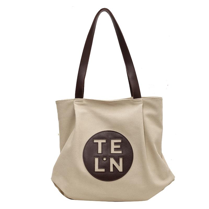 

Повсякденна нішева преміальна сумка для жіночої літньої 2024 року нова полотняна сумка в корейській версії великої місткості сумка через плече