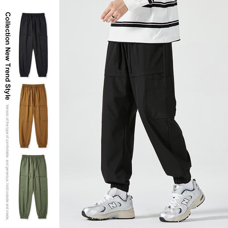 Men's American-Style Autumn Overalls: Fashionable, Casual, Versatile Nine-Point Pants with Loose Cuffs and Multi-Pocket Design.