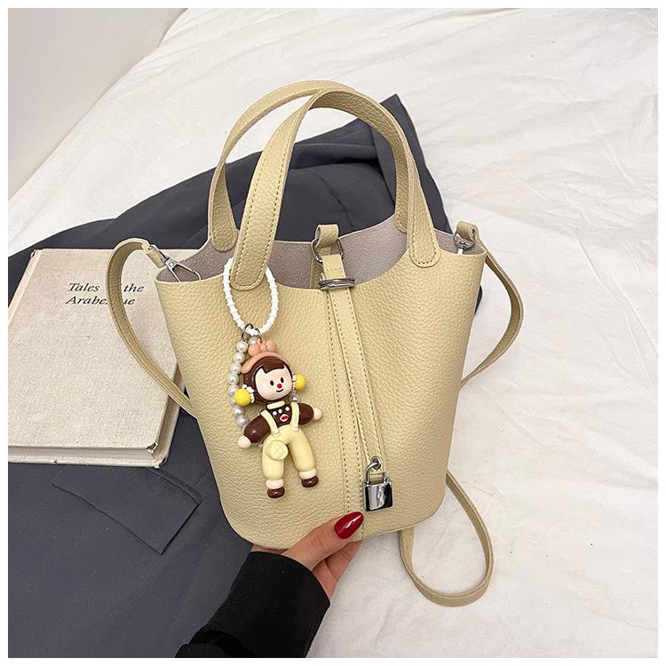 Beliebte tragbare Eimertasche Damen Frühling und Sommer 2025 Neue einfache und lässige Umhängetasche Modische Umhängetasche
